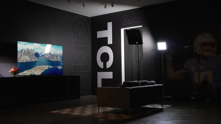 THe TCL QM8 Mini-LED TV in a TCL studio room. 