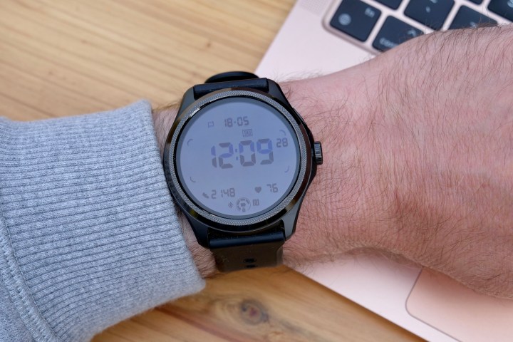 The Mobvoi TicWatch Pro 5 on a person's wrist, showing the secondary display.