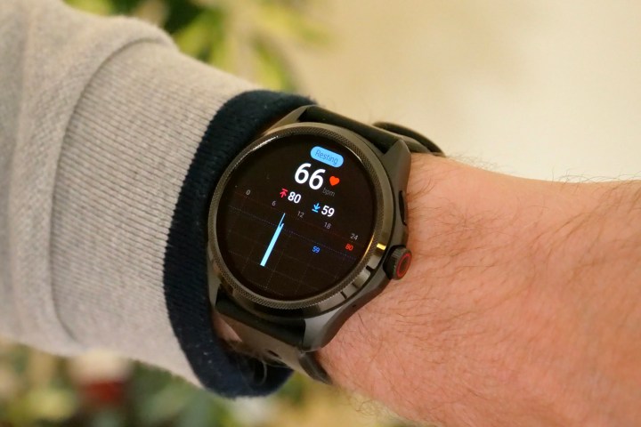 The Mobvoi TicWatch Pro 5 on a person's wrist, showing the heart rate screen.