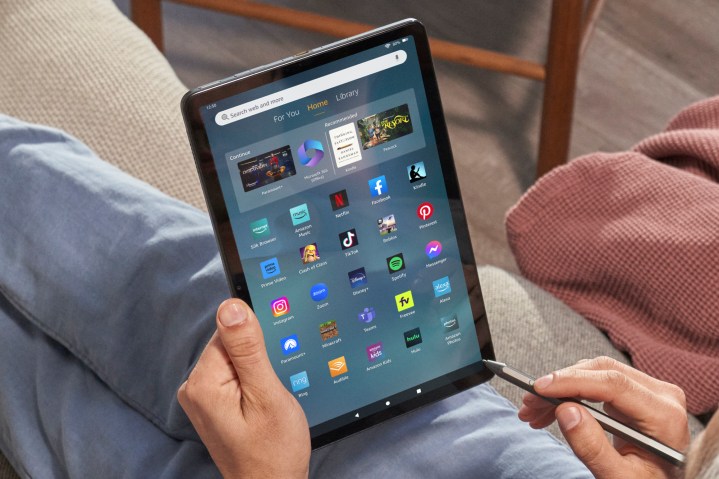 Someone holding the Amazon Fire Max 11 tablet.
