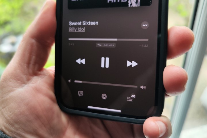 Apple Music on an iPhone 14 playing a lossless audio version of Sweet Sixteen by Billy Idol.