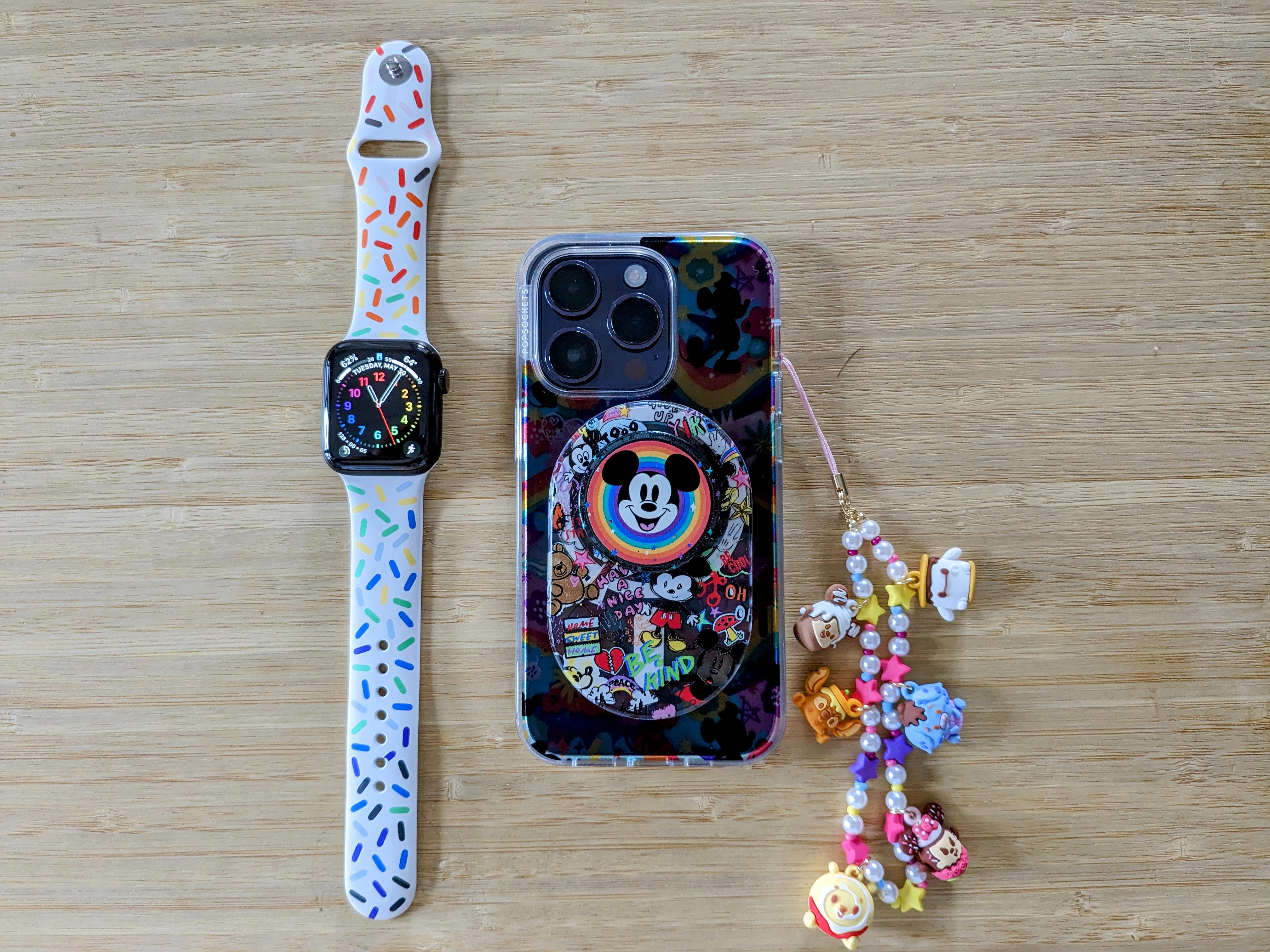 Pride Edition 2023 Sport Band on Series 5 with an iPhone 14 Pro in PopSockets Disney Pride case