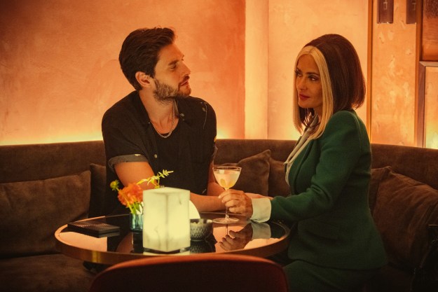 A man and a woman share a drink in Black Mirror season 6.