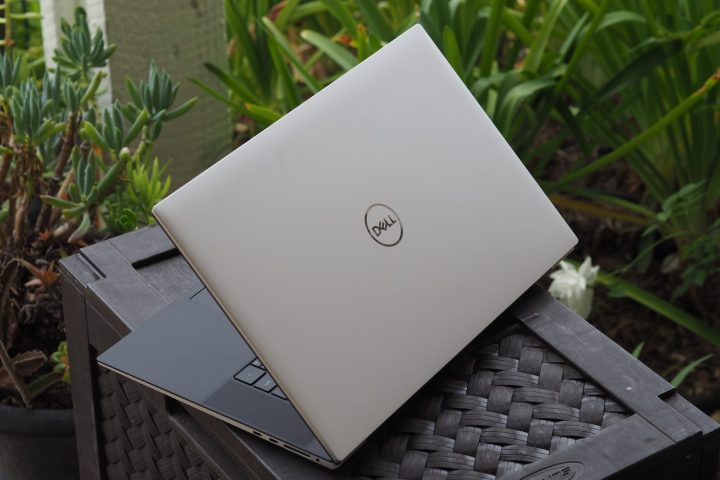 The Dell XPS laptop seen from behind, with the chassis half open.