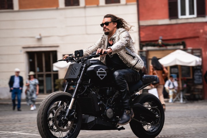 Jason Momoa rides a motorcycle in Fast X.