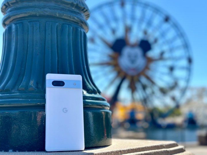 Google Pixel 7a leaning against pillar at DCA Pixar Pier