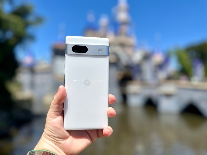 google pixel 7a review in hand at disneyland castle