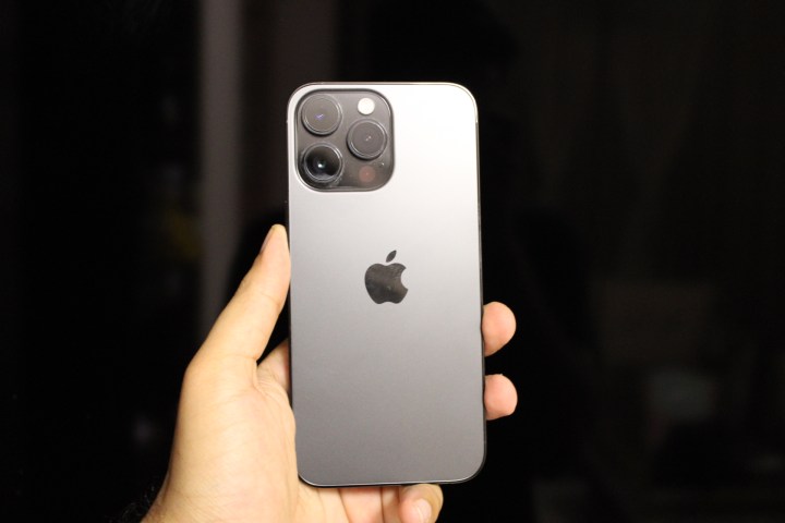 iPhone 14 Pro Max in hand.