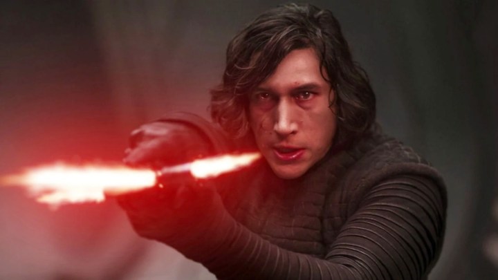 Kylo Ren aims his lightsaber in The Force Awakens.