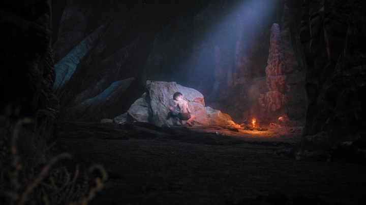 Gollum hides behind a rock in The Lord of the Rings: Gollum.