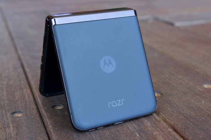 The back of the Motorola Razr Plus, propped up on a wooden floor.