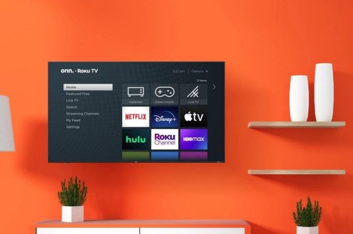The onn. 75” Class 4K UHD (2160P) LED Frameless Roku Smart TV is a living room with orange walls.