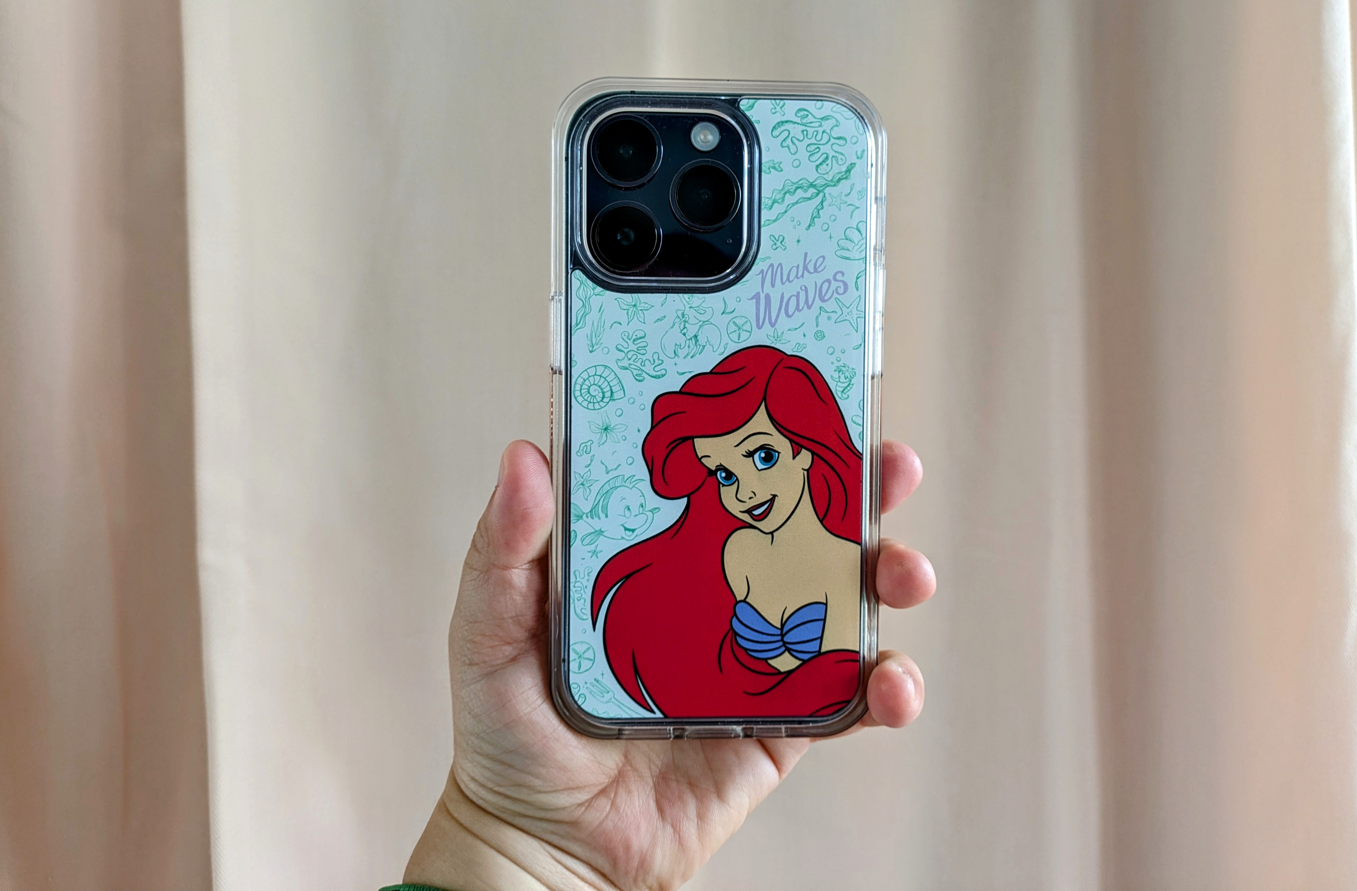 OtterBox Symmetry Series+ Disney Princess Ariel variant case on iPhone 14 Pro