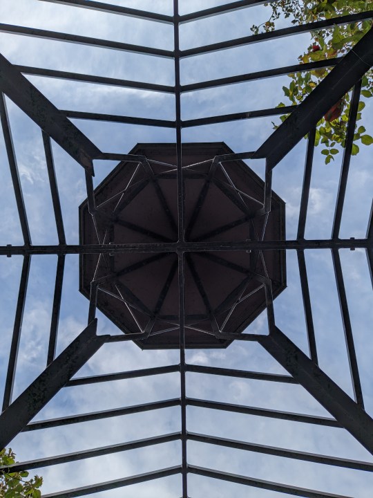 Metal canopy with sky peeking through taken with Google Pixel 6a main camera