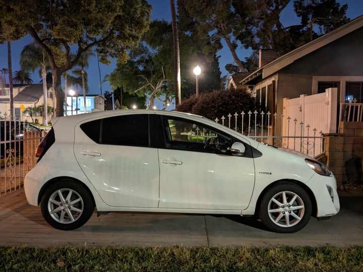 Side view of a Toyota Prius C in driveway taken with Google Pixel 6a Night Sight