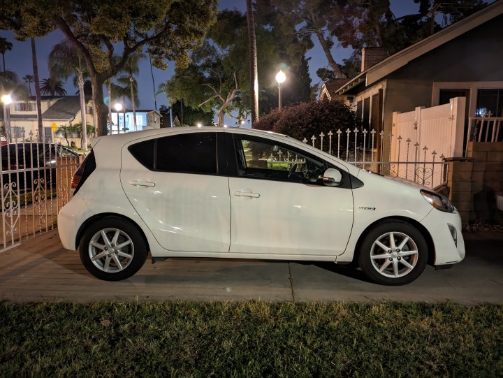 Side view of Toyota Prius C in driveway taken with Google Pixel 7a night sight