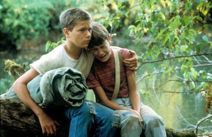 A boy holds another boy in Stand By Me.