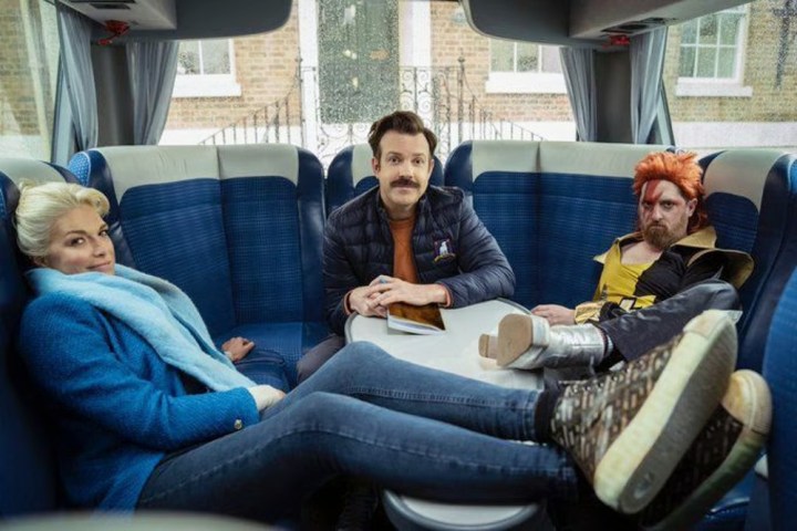 Three people hang out in a bus in Ted Lasso.