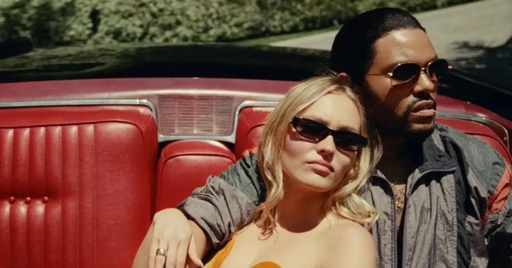 The Weeknd and Lily-Rose Depp lounge in a car in The Idol.