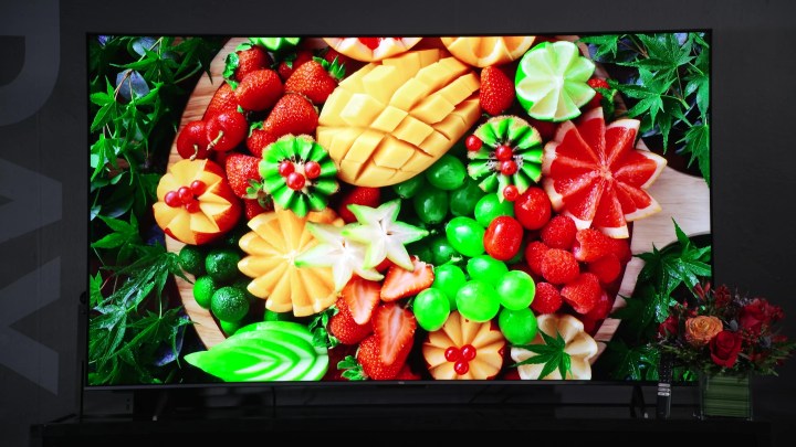 A vibrant fresh fruit platter shown on a TCL Q6.