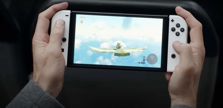 A man plays the Switch in a Tears of the Kingdom commercial.