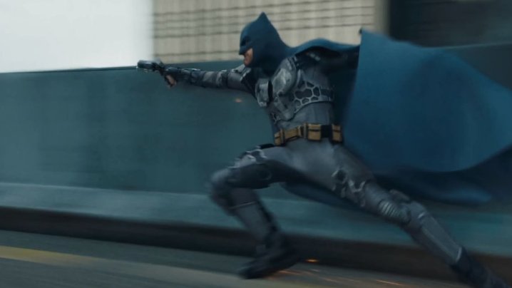 Ben Affleck as Batman skidding across the streets in The Flash.