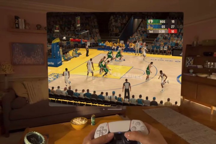 A man plays NBA 2K23 on a Vision Pro with a DualSense controller.