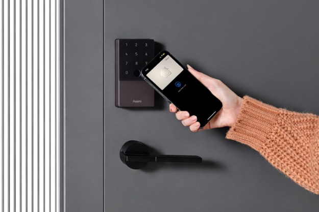 A person unlocking the Aqara U100 smart lock with their phone.