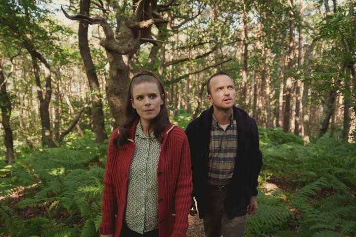 Kate Mara and Aaron Paul walk in a forest in Black Mirror.