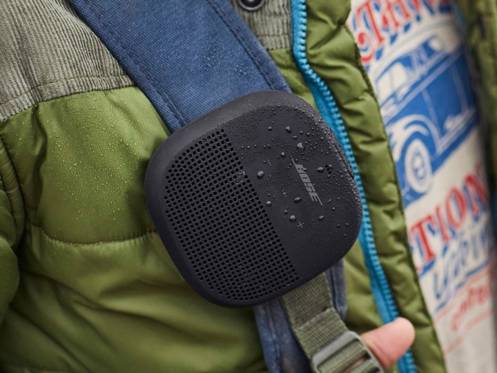 The Bose SoundLink Micro portable BLuetooth speaker, worn outside.