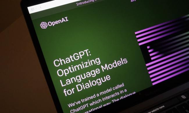 A laptop screen shows the home page for ChatGPT, OpenAI's artificial intelligence chatbot.