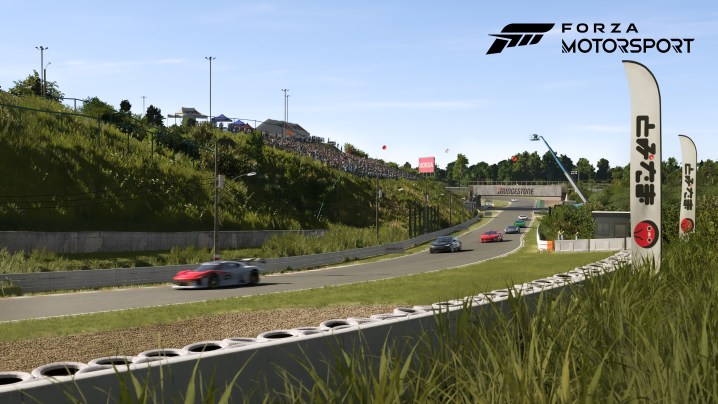 Cars race on a track in Forza Motorsport