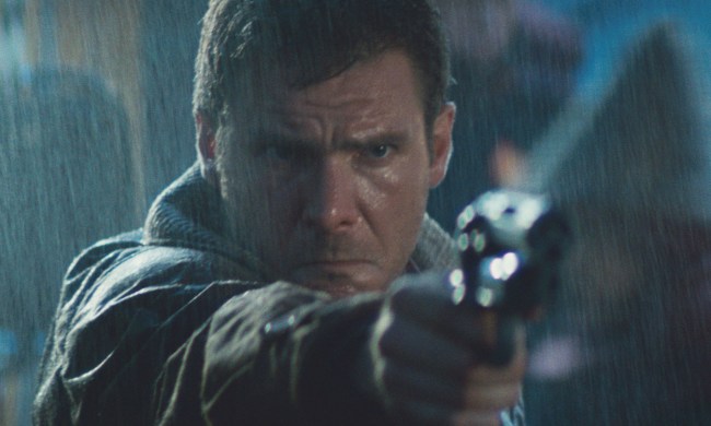 A man points a gun in Blade Runner.