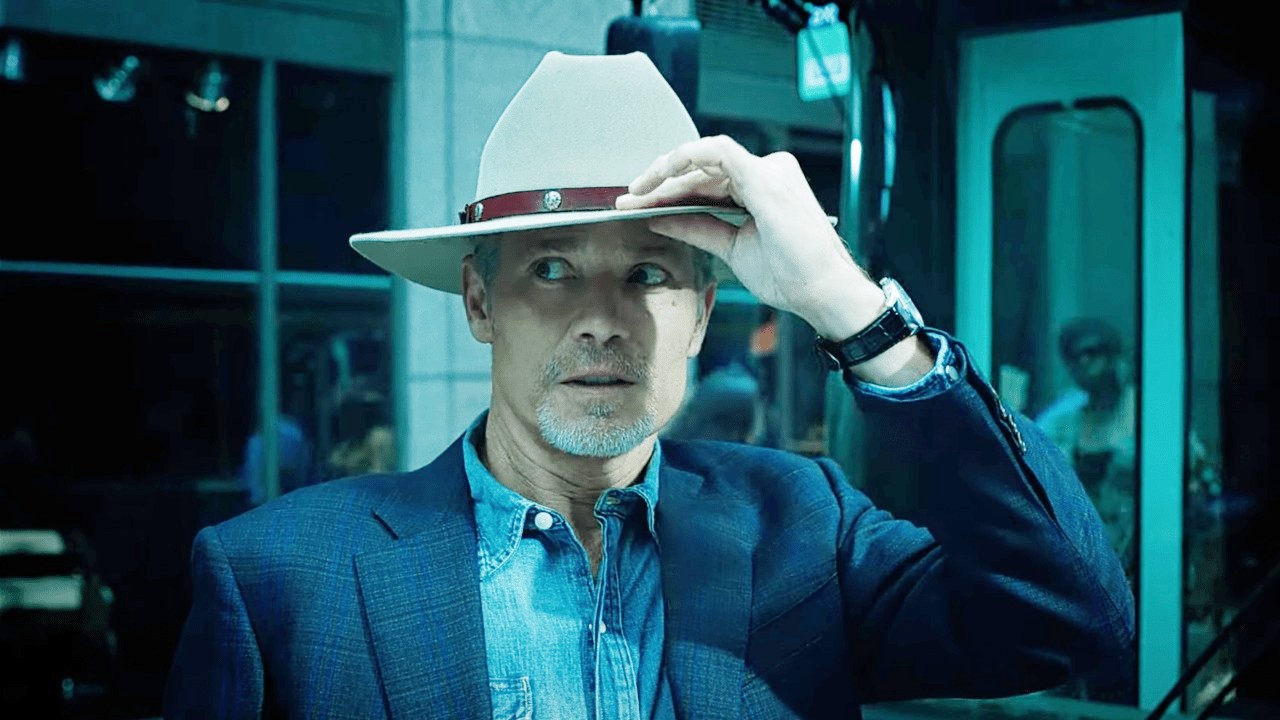 A man touches his hat in Justified: City Primeval.
