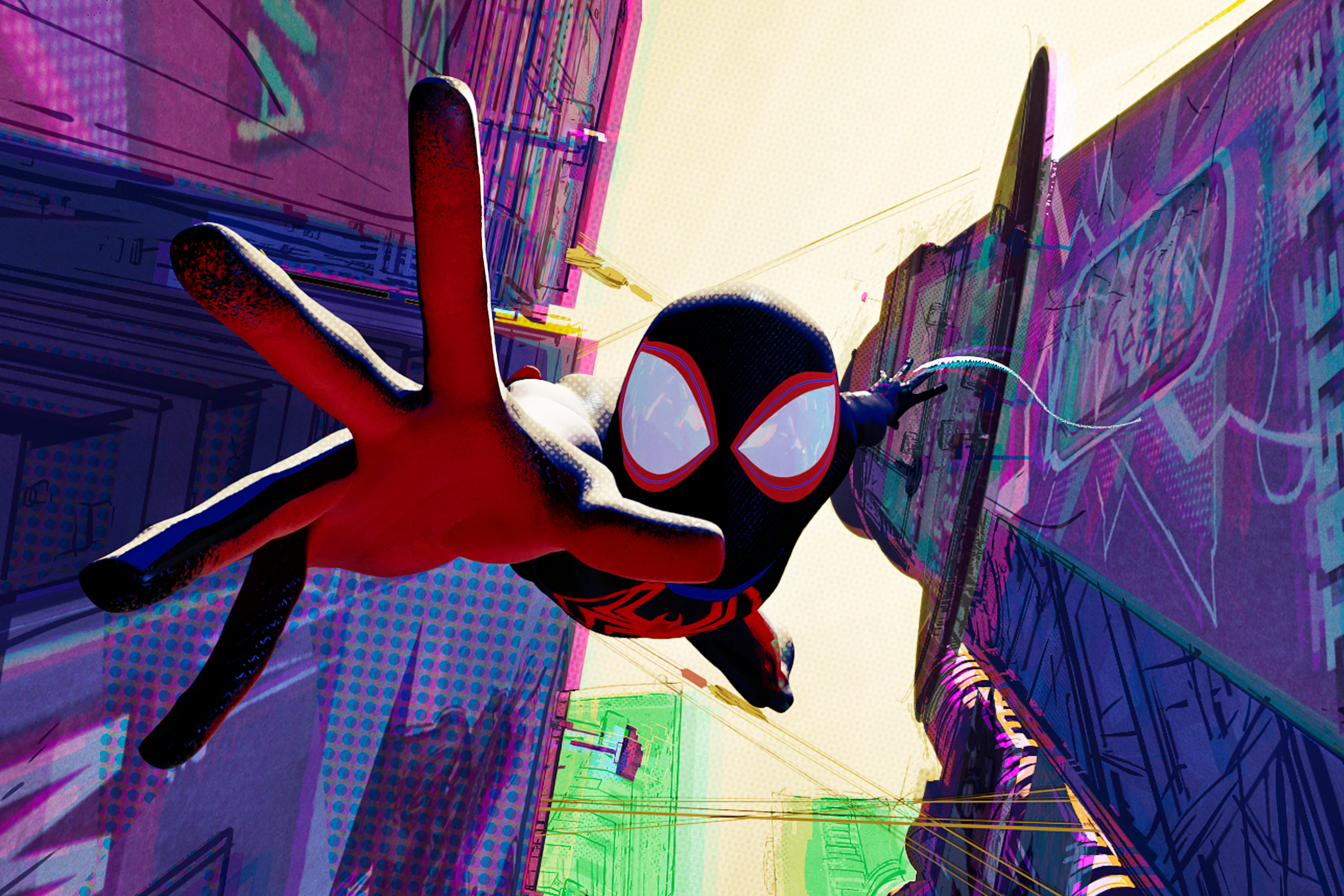 Miles Morales falls in between two buildings in Spider-Man: Across the Spider-Verse.