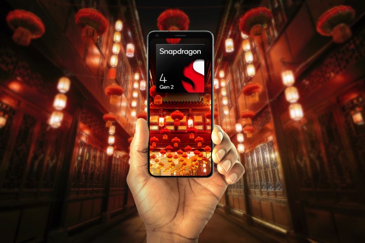 Hand holding phone with Qualcomm Snapdragon 4 Gen 2 logo.