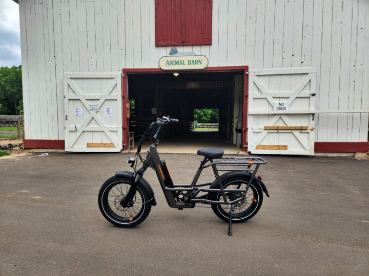 rad power bikes radrunner 3 plus review parked in front of an animal barn a park