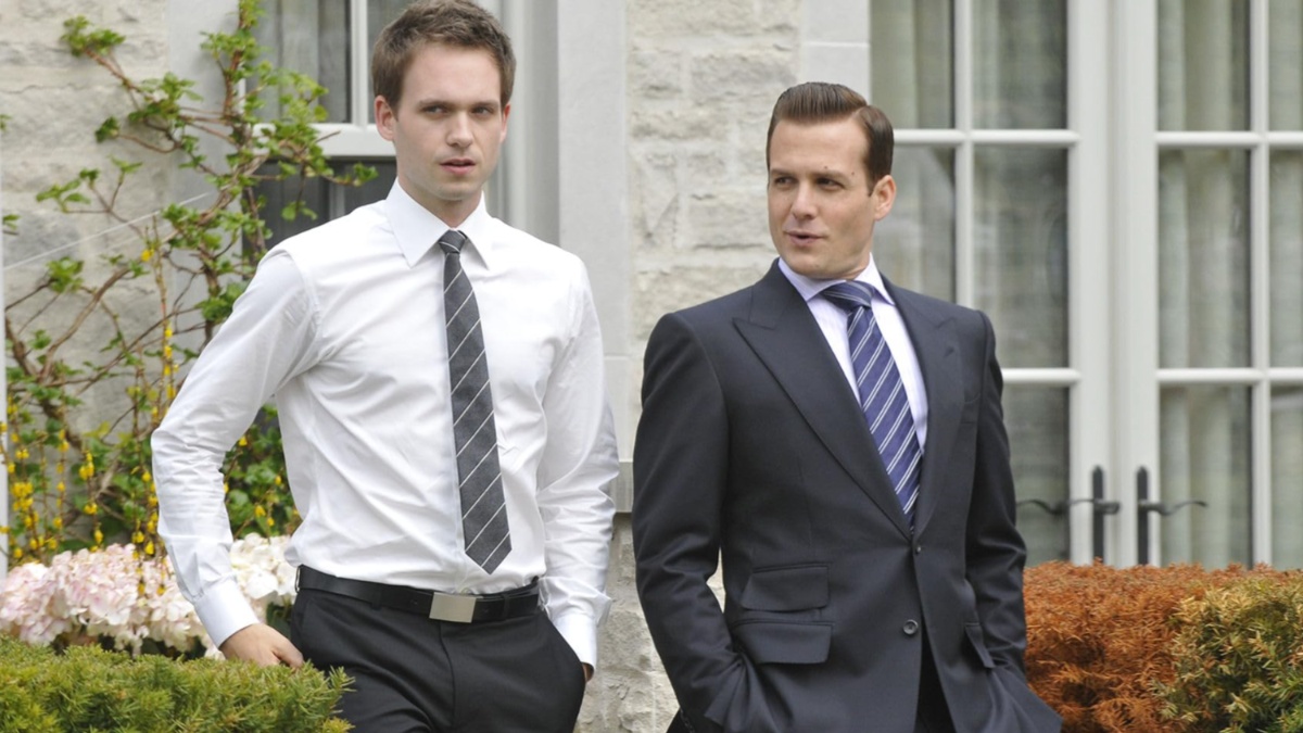 Patrick J. Adams and Gabriel Macht stand next to each other in Suits.