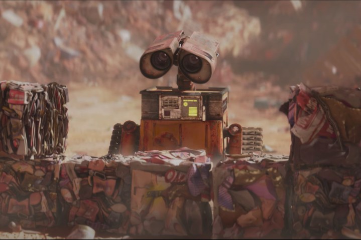 WALL-E looks at cubes of trash.