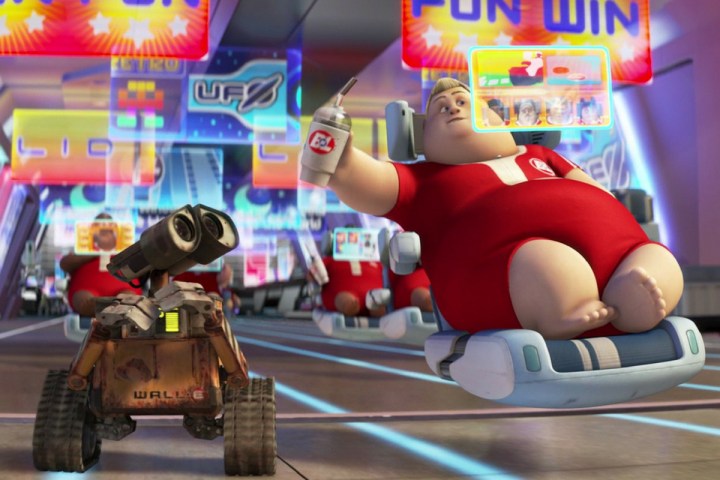 WALL-E anda ao lado de um humano em uma cadeira flutuante.