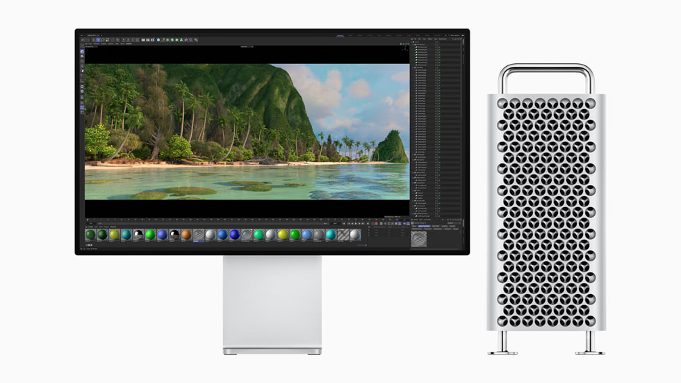 स्क्रीन के बगल में Apple का Mac Pro।