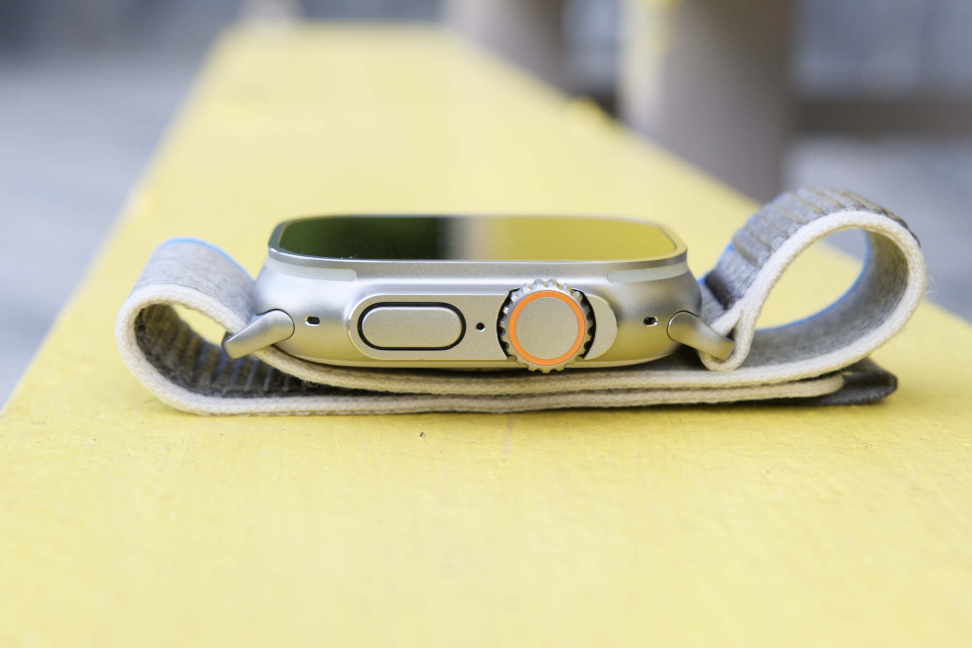 Side view of the Apple Watch Ultra, showing its Digital Crown and side button.
