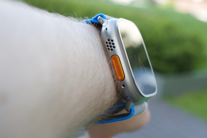 Side view of someone wearing the Apple Watch Ultra.