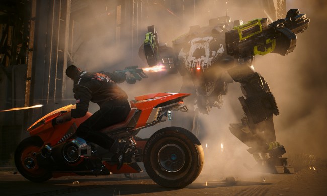 V rides a motorcycle while shooting at a mech in Cyberpunk 2077: Phantom Liberty.