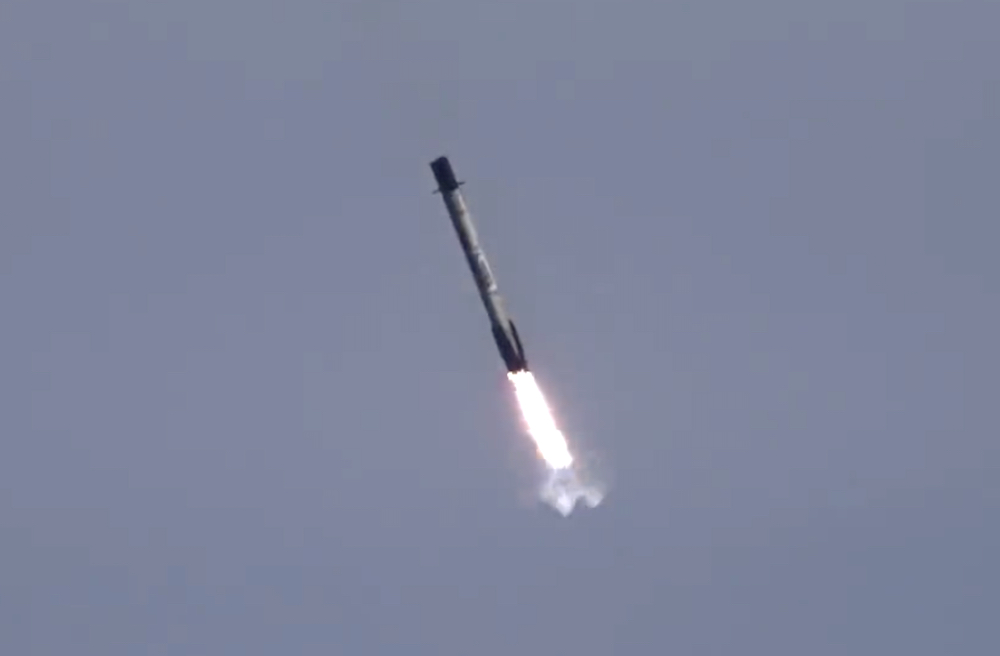 A SpaceX Falcon 9 booster coming in to land.