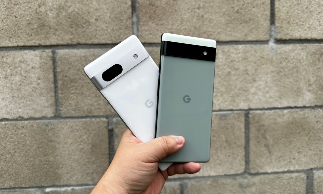 Sage green Pixel 6a and Snow Pixel 7a in hand