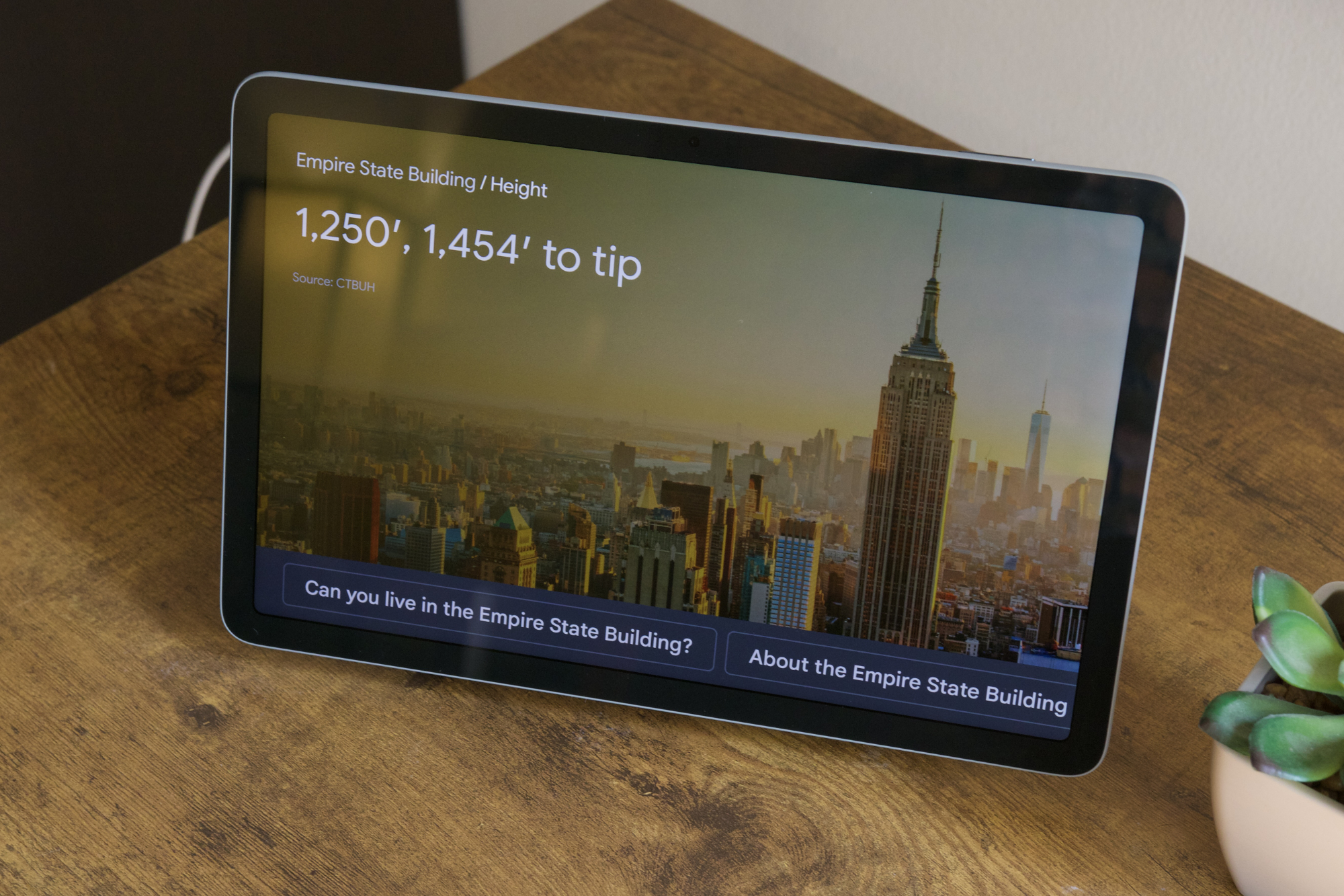 The Google Pixel Tablet showing the height of the Empire State Building.