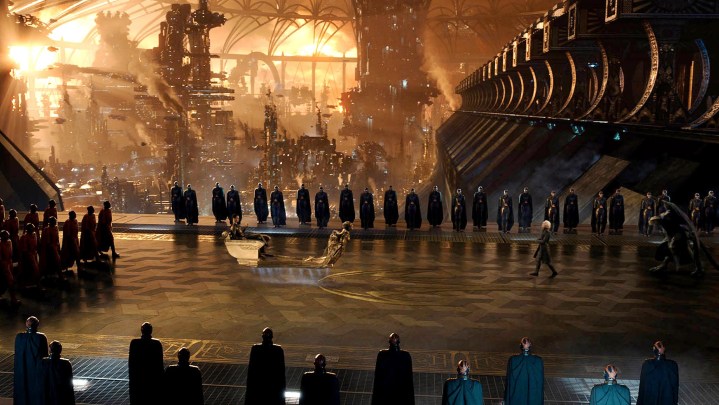 People stand in a royal court in Jupiter Ascending.