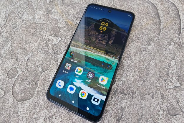 The Moto G 5G laying on a table.