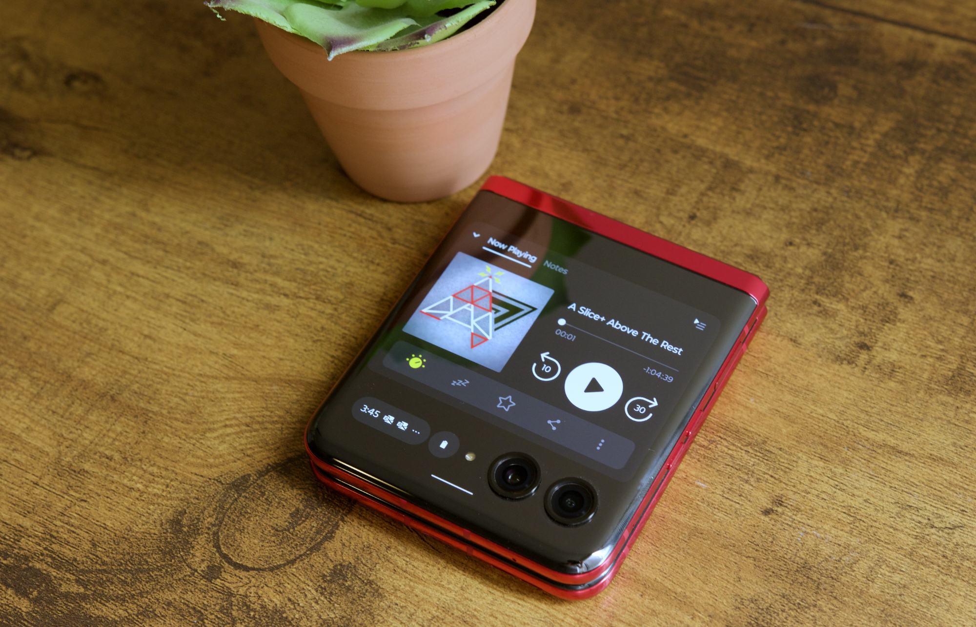 Pocket Casts app running on the Motorola Razr Plus cover screen.